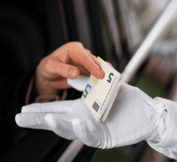 Gloved hand receiving a card