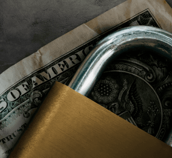 Padlock over a dollar bill